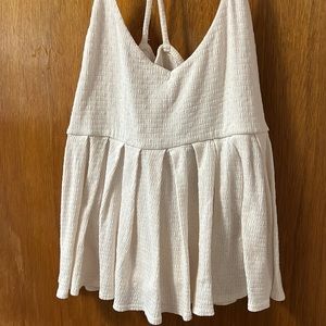 Purchased at urban outfitters, cream flowy top size medium with crisscross back